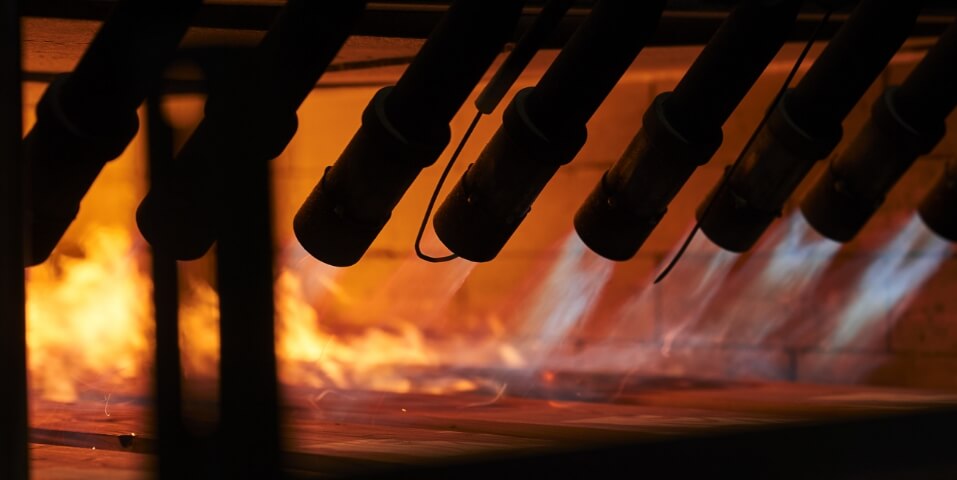 Degmeda factory timber being charred with fire