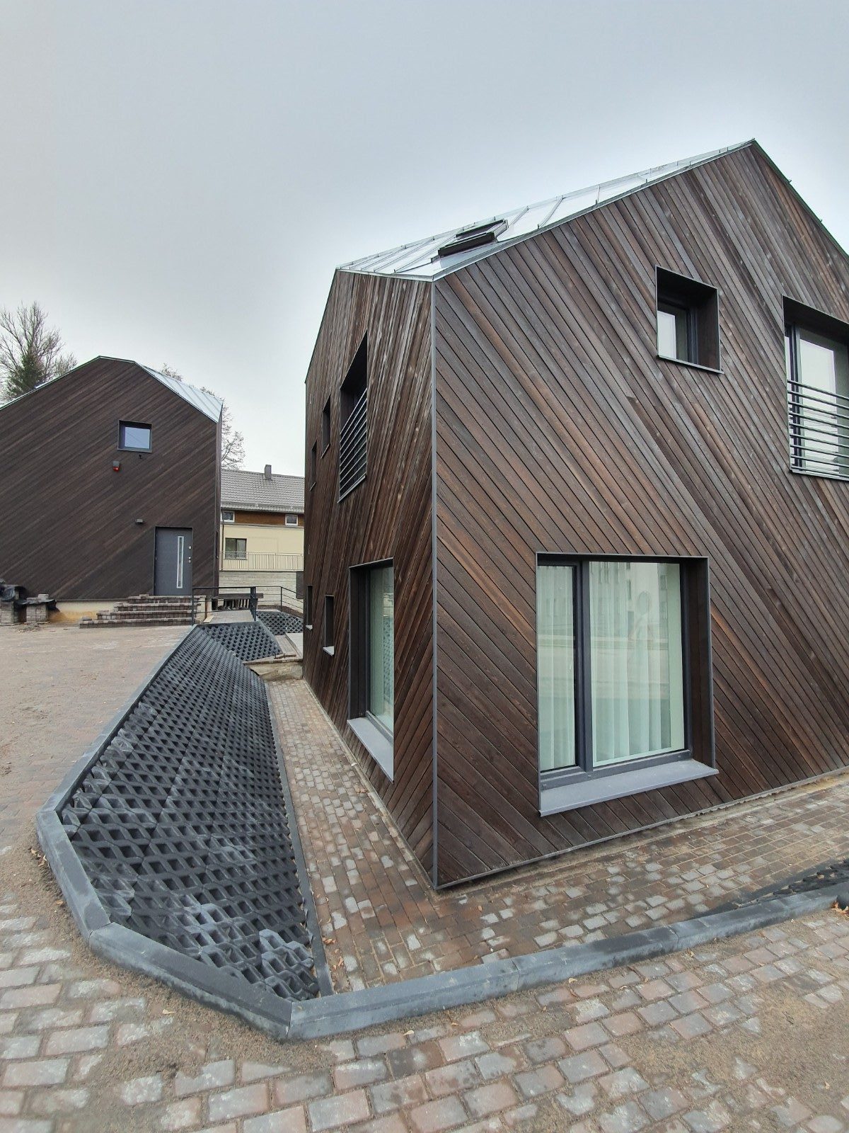 A small family house with Spruce charred wood siding