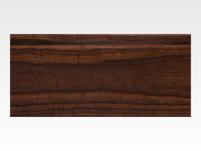 Accoya-Dark-Natural-s-1 Dark, polished wooden plank with pronounced grain set against a light gray background, showing rich brown tones and texture, viewed edge-on at the top of the image.