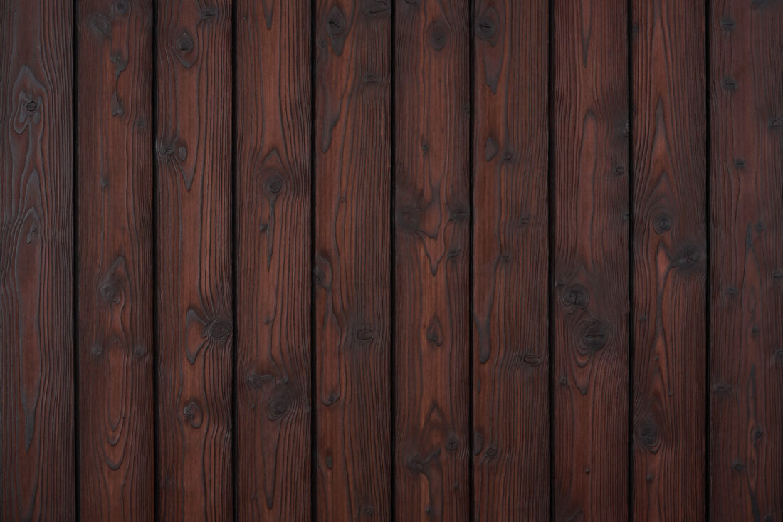 Charred Red Amber larch boards with deep reddish-brown colour
